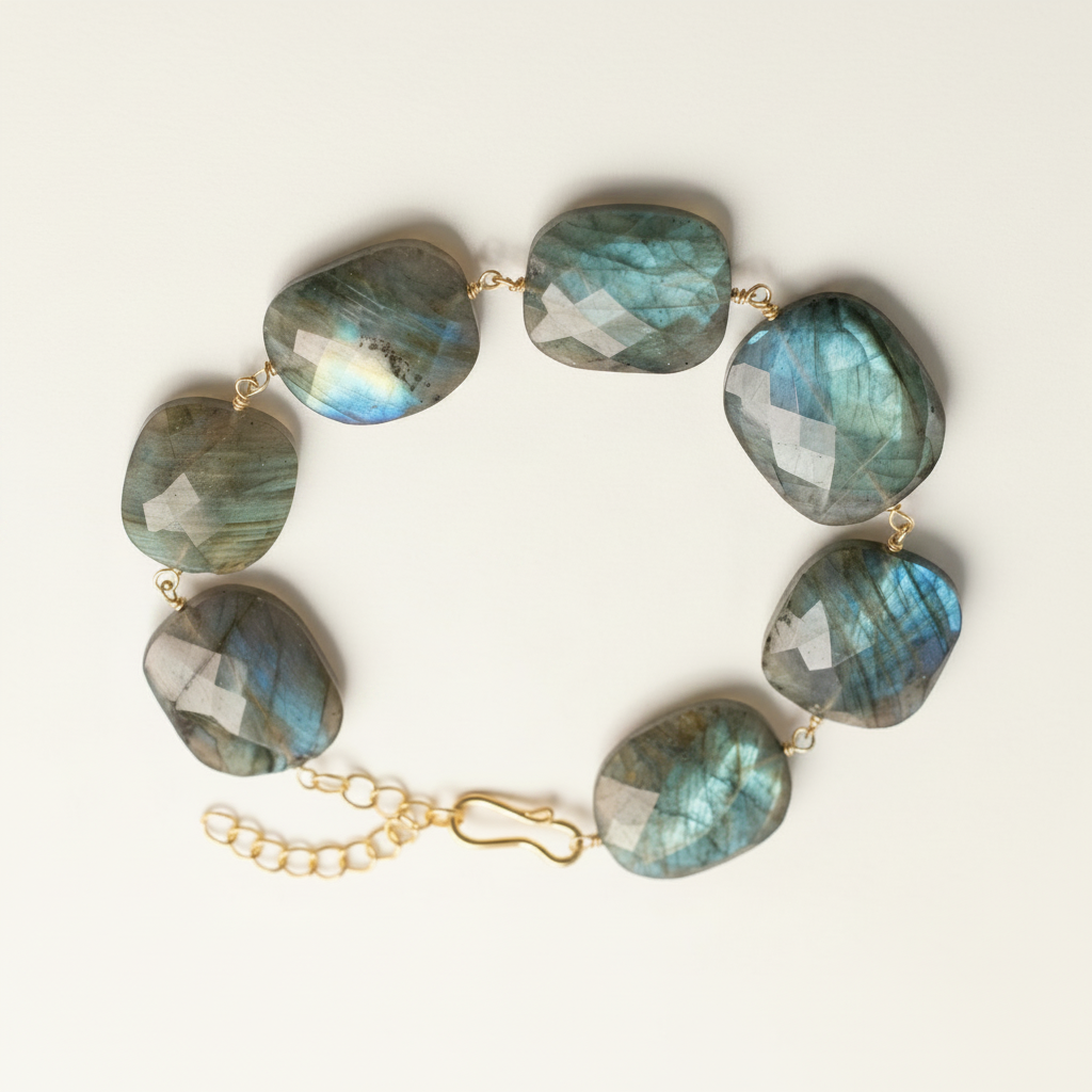 Labradorite stone bracelet with large oval blue-green cabochons and gold links