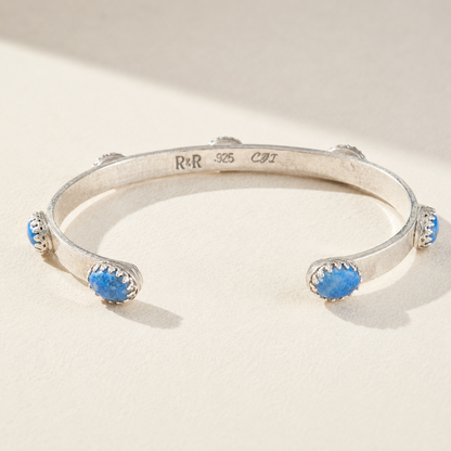 Silver cuff bracelet stamped 925 with two blue bead stones on open bangle