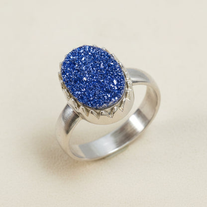 Oval druzy ring with blue sparkling stone and silver-tone band
