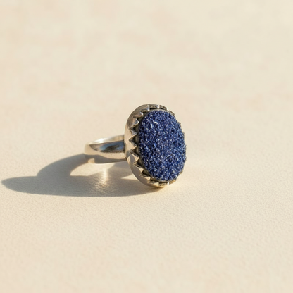 Oval druzy ring with textured blue druzy center and silver-tone shank