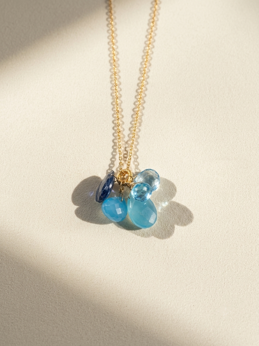 Dainty stone cluster necklace with gold chain and blue cluster stones