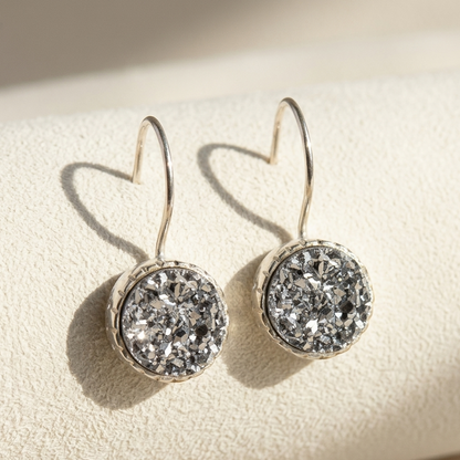 Iridescent silver druzy round dangle earrings with silver-tone round settings and hoop hooks