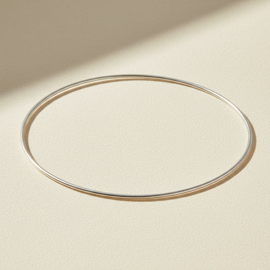 Thin silver bangle bracelet, smooth oval cuff