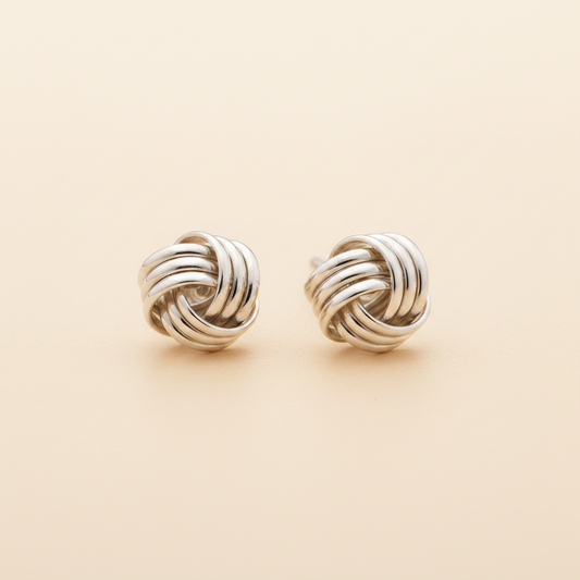 Silver-tone twisted knot stud earrings with round braided design
