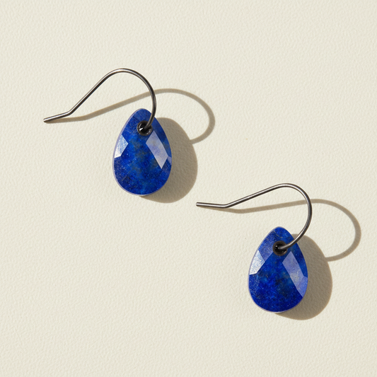Blue teardrop stone earrings with metal fishhook and dark bezel setting
