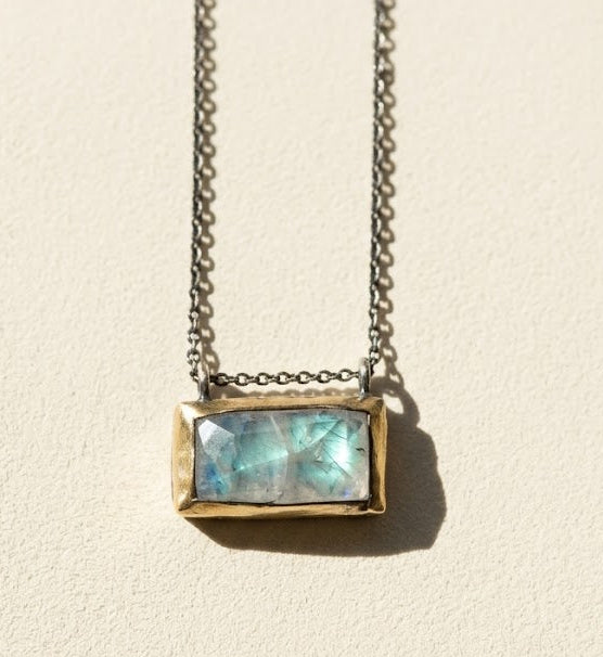 Rectangle pendant necklace with blue-green gem set in gold-tone bezel and chain