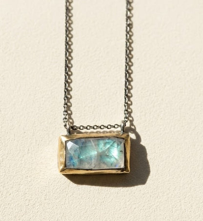 Rectangle pendant necklace with blue-green gem set in gold-tone bezel and chain