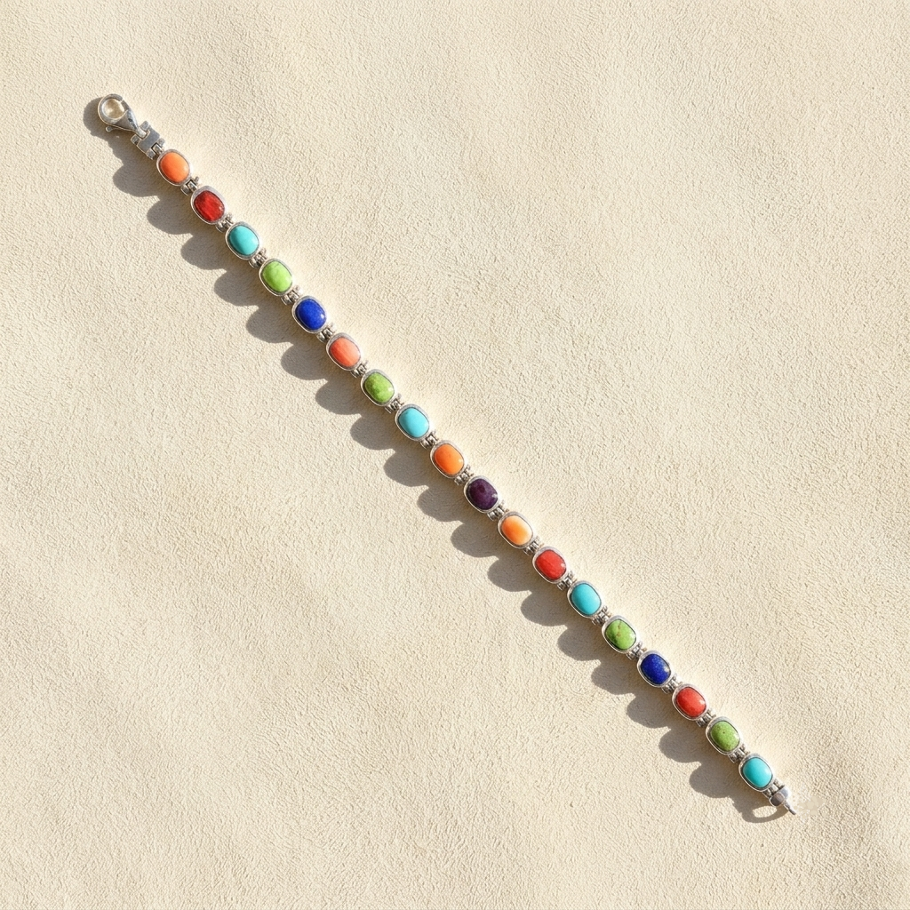 Silver bracelet with colorful oval cabochons, including blue, green, red, and purple