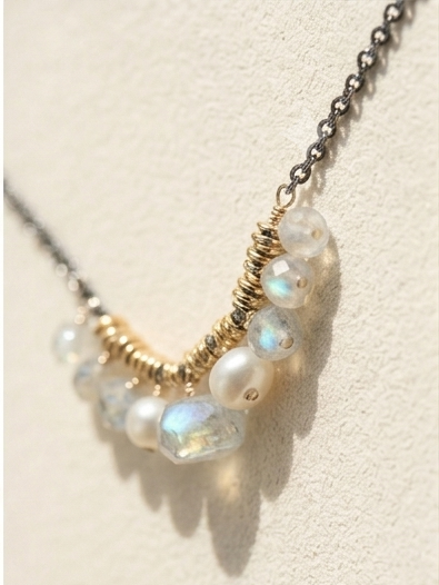 Iridescent opal-like beads and white pearls in a gold-tone cloud cluster necklace chain