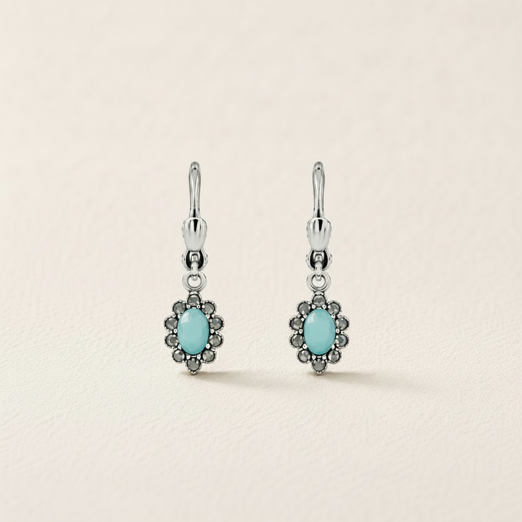 Silver-tone flower drop earrings with turquoise oval center and dark stone border