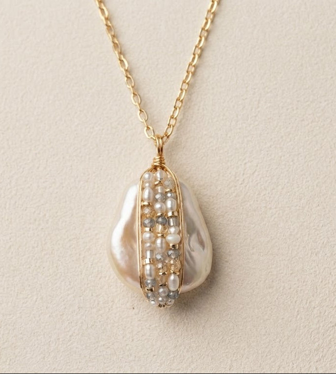 Gold chain bead-wrapped pearl teardrop pendant with pearl-and-bead detailing