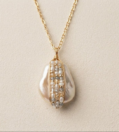 Gold chain bead-wrapped pearl teardrop pendant with pearl-and-bead detailing