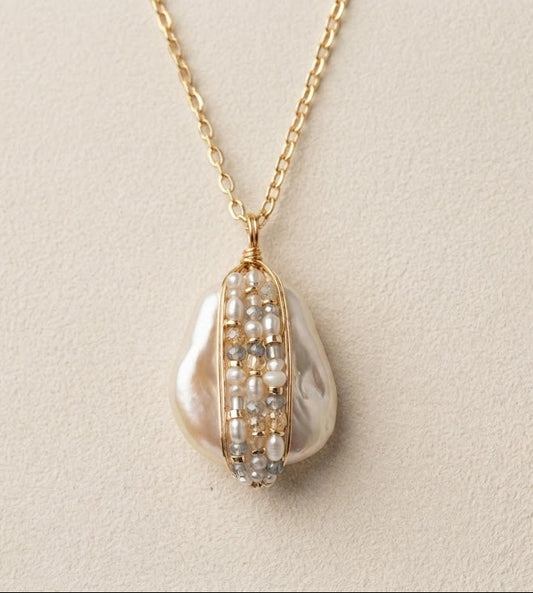 Gold chain bead-wrapped pearl teardrop pendant with pearl-and-bead detailing