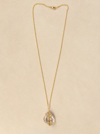 Gold chain necklace with small clasp and teardrop pearl bead-wrapped pendant