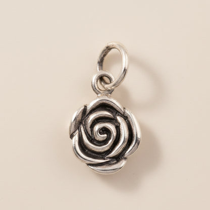 Silver-tone rose swirl pendant charm with hanging loop