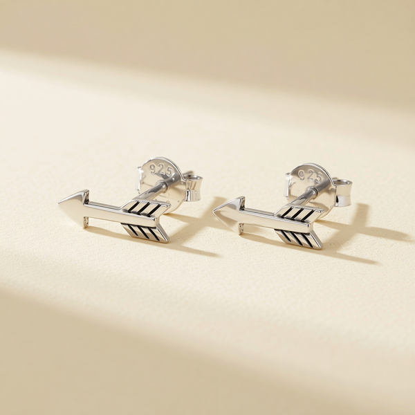Silver-toned arrow stud earrings with black inlay stripes; 925 marked backs visible