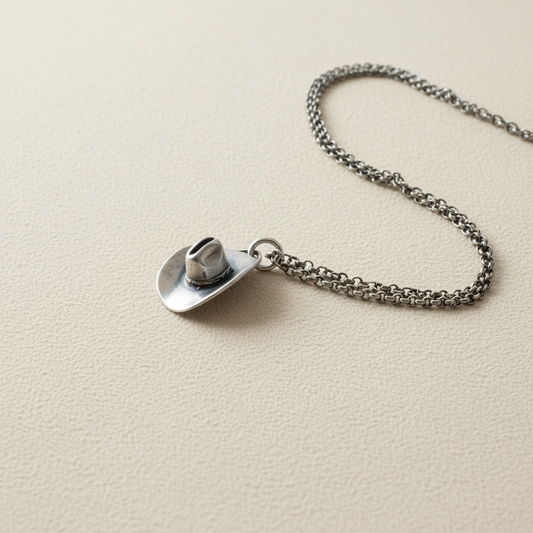 Silver-tone cowboy hat pendant necklace with circular hat charm on link chain