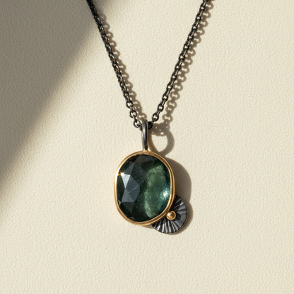 Gunmetal chain necklace with dark teal gemstone pendant and ridged edges