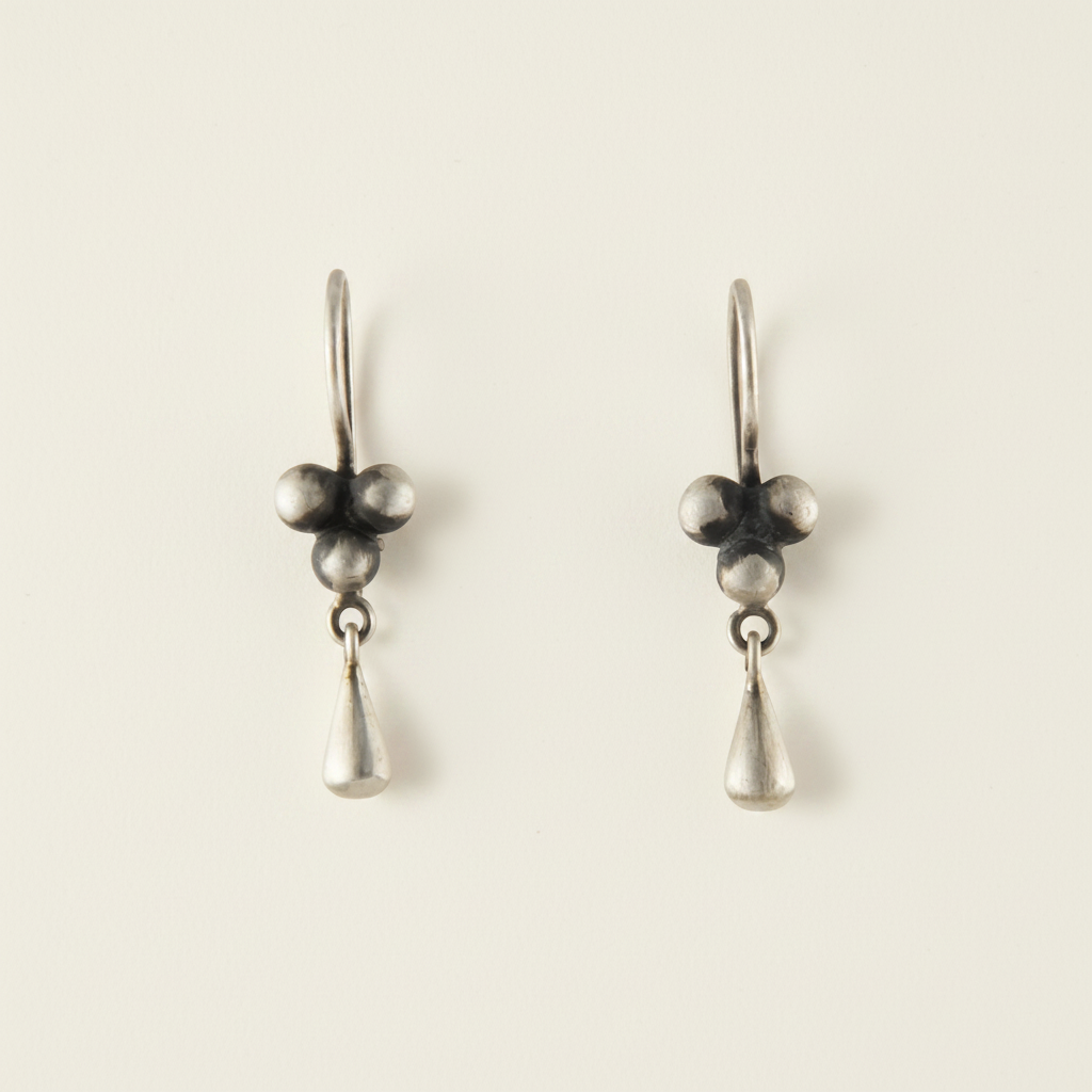 Ball cluster drop earrings with three dark bead spheres and teardrop dangles