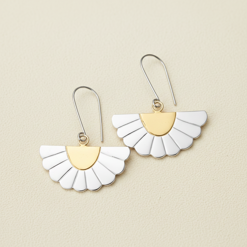Gold and white fan-shaped drop earrings with scalloped petals, on curved hooks.