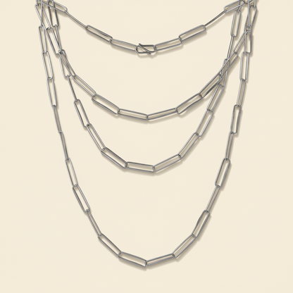 Triple-strand paperclip-link chain necklace with silver-tone linked segments.