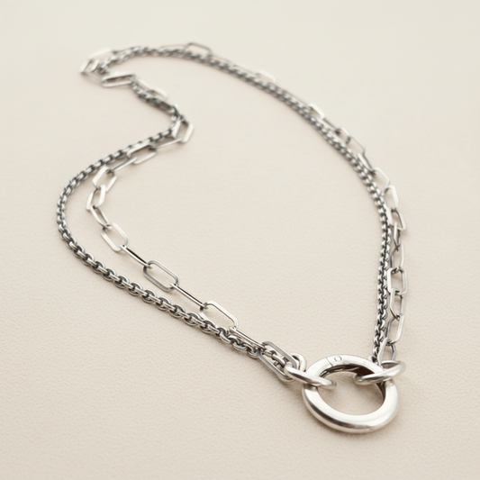 Silver-tone double chain necklace with hammered ring at center