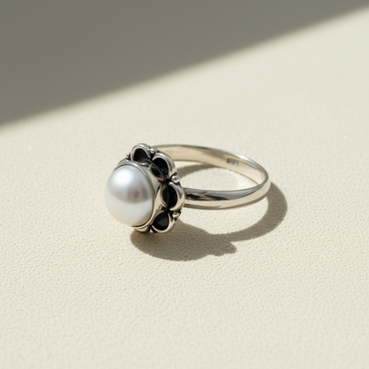 South Sea pearl ring with round white pearl and black scalloped bezel