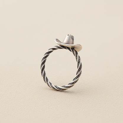 Silver cowboy hat ring with braided rope band and dark swirl detailing