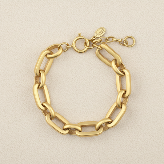 Gold tone rectangular link bracelet with oval clasp and connected chain links