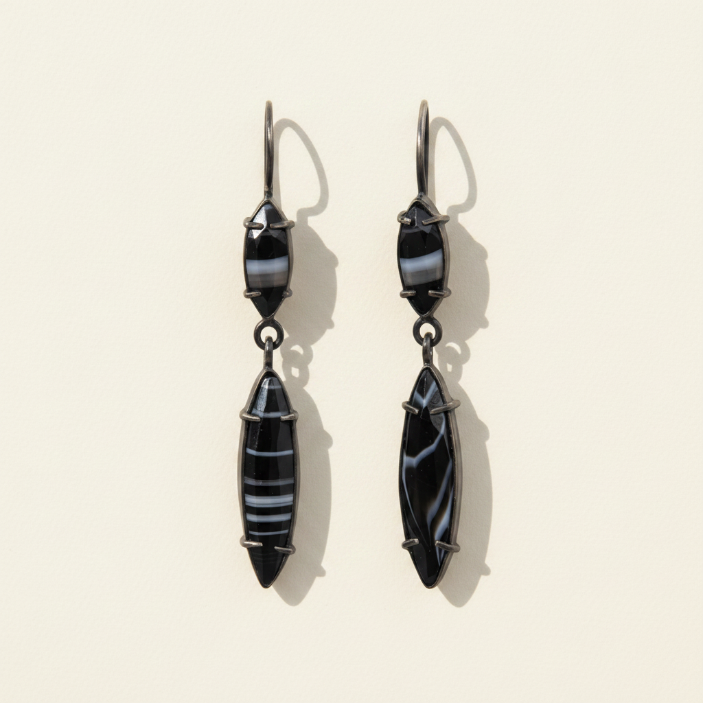 Dark blue marquis drop earrings with faceted geometric dangling charms