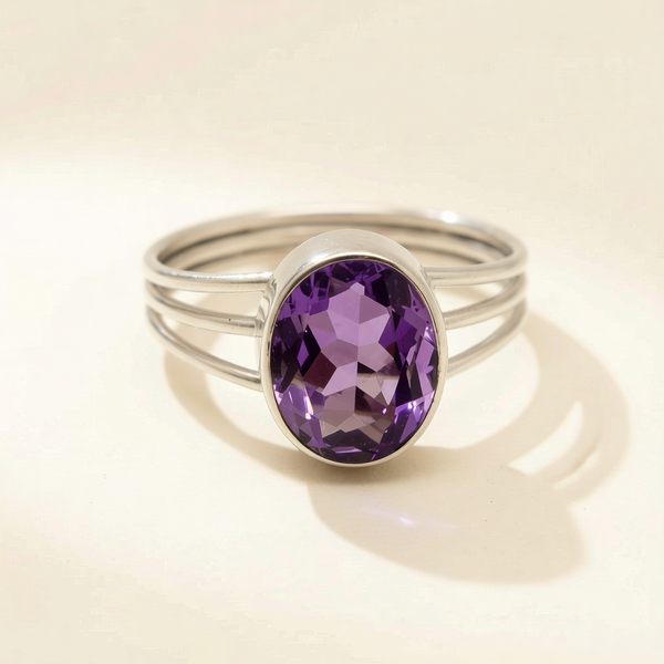Triple band ring with oval amethyst-purple gemstone set in silver