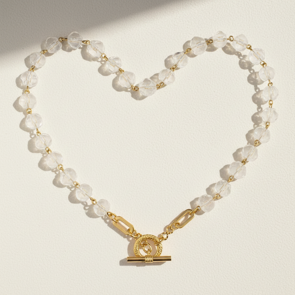 Clear crystal beaded necklace with gold-tone round pendant