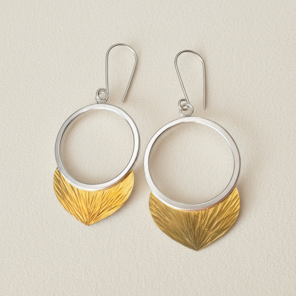 Round silver-tone hoop drop earrings with gold textured leaf dangle