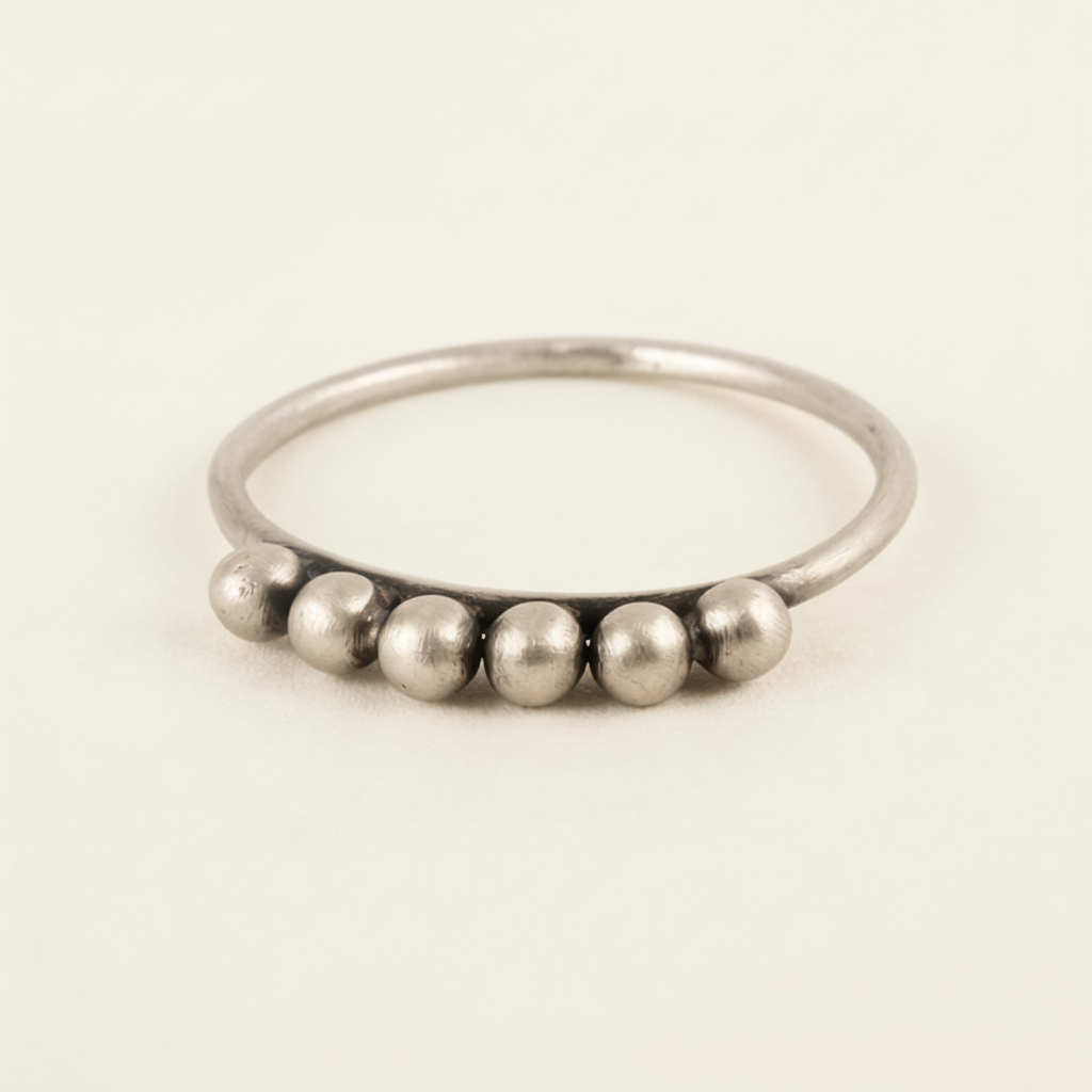 Six-ball granulated ring with six silver spherical beads on a slim band