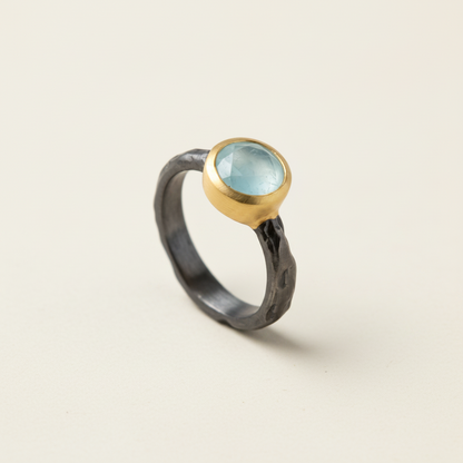 Hammered band chalcedony ring with round blue stone and gold bezel