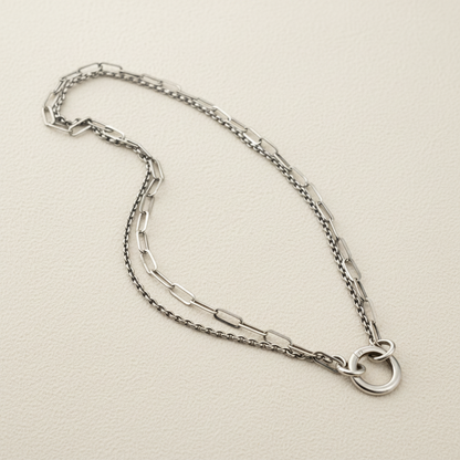 Silver-tone double chain necklace with linked chains and hammered ring detail