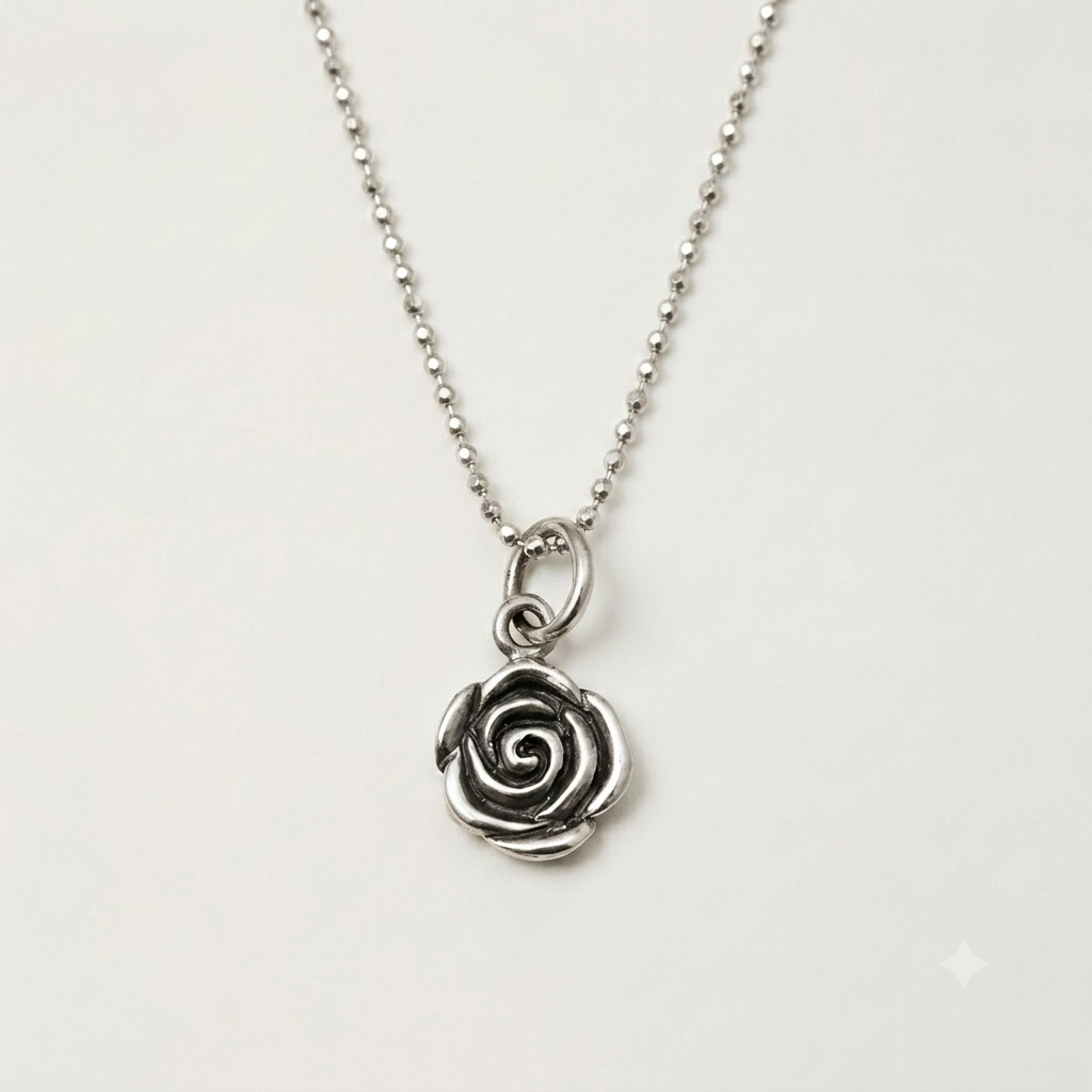 Silver-tone rose swirl pendant with dainty link chain
