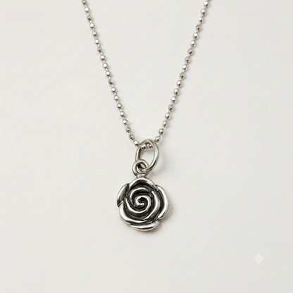Silver-tone rose swirl pendant with dainty link chain