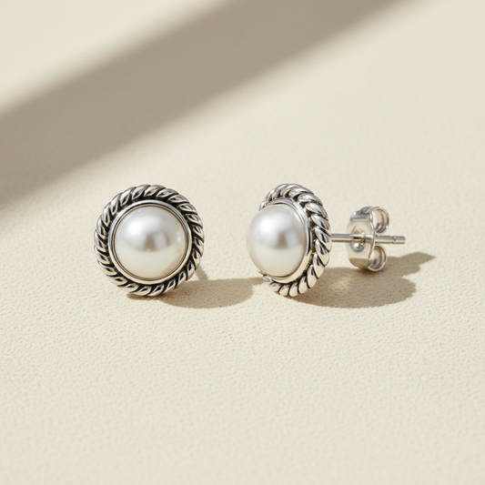 Freshwater pearl stud earrings with rope-textured silver bezel