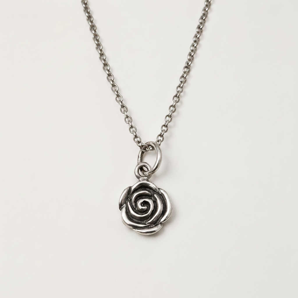 Silver-tone rose swirl pendant on short chain with round clasp