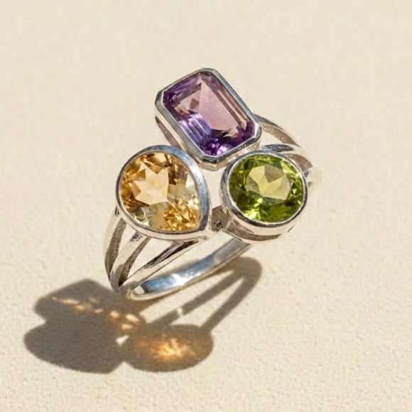 Silver trio gemstone ring with amethyst, citrine, and peridot stones in bezels