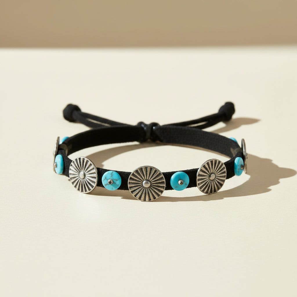 Turquoise beaded tether bracelet with black cord and silver circular medallions