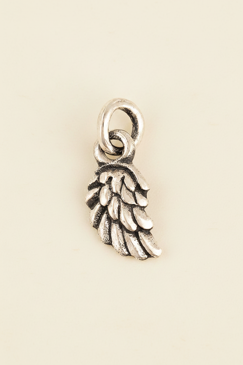 Silver wing charm pendant with circular bail