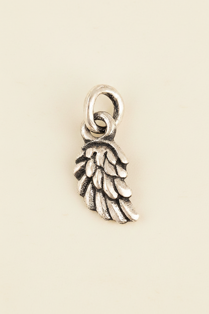 Silver wing charm pendant with circular bail
